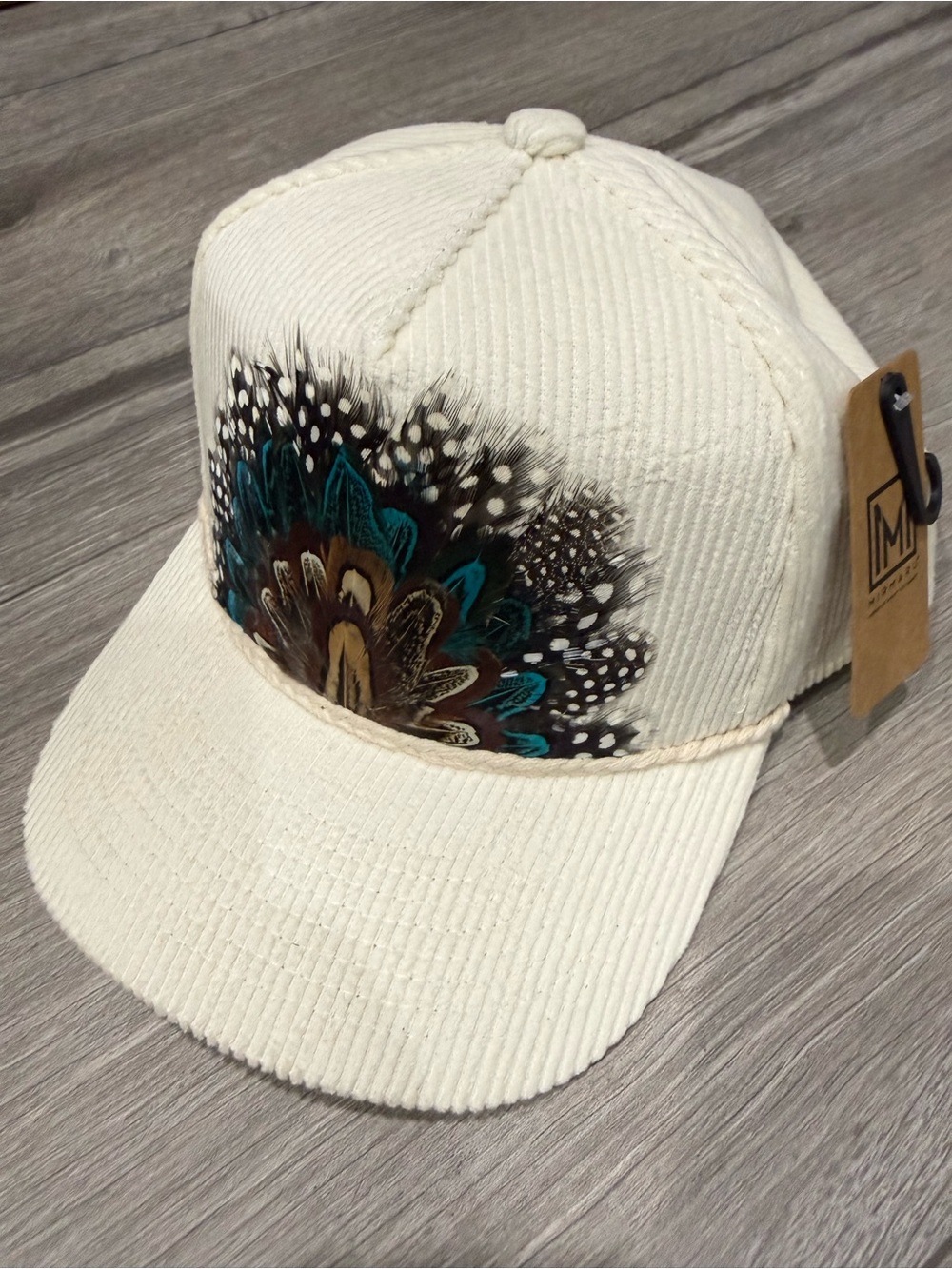 Mi Cream Corduroy Cap with Teal and Brown Feather Design